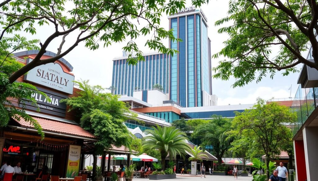 A lush, vibrant scene of Central Salaya, a bustling hub of dining, entertainment, and accommodation. In the foreground, an array of local eateries and cafes beckon, their facades adorned with colorful decor and tantalizing aromas wafting through the air. The middle ground reveals a modern, well-designed complex with sleek architecture and verdant landscaping, hinting at the range of activities and amenities available. In the background, the towering presence of a state-of-the-art cinema complex stands proud, its grand facade inviting visitors to indulge in the latest cinematic experiences. The overall atmosphere exudes a perfect balance of urban sophistication and a welcoming, community-driven ambiance, capturing the essence of a thriving, multi-faceted destination.